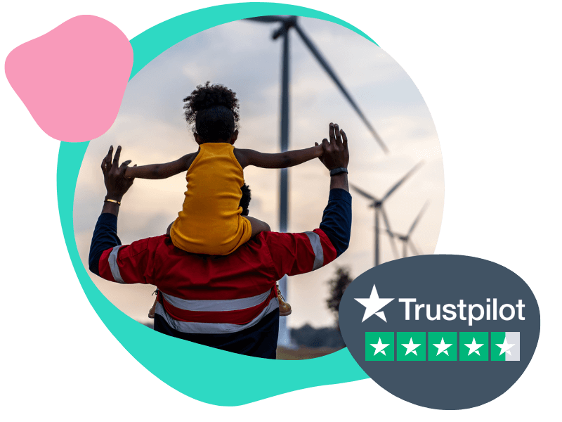 Girl on her dads shoulders with wind turbines in background
