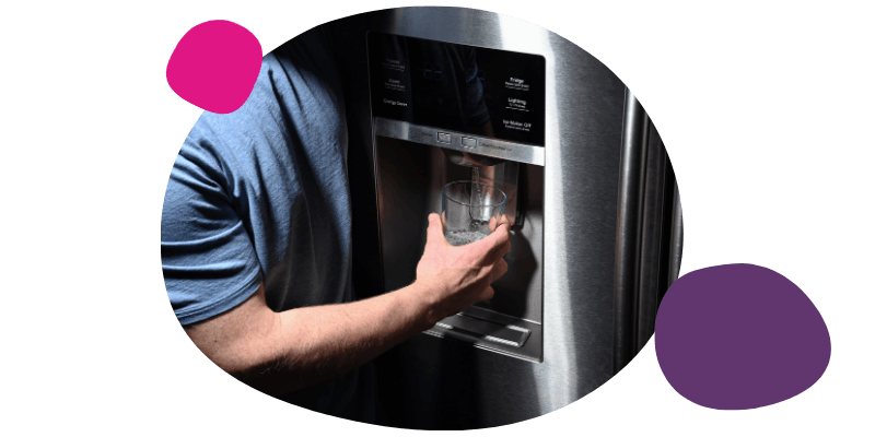 man using a water dispenser from a fridge