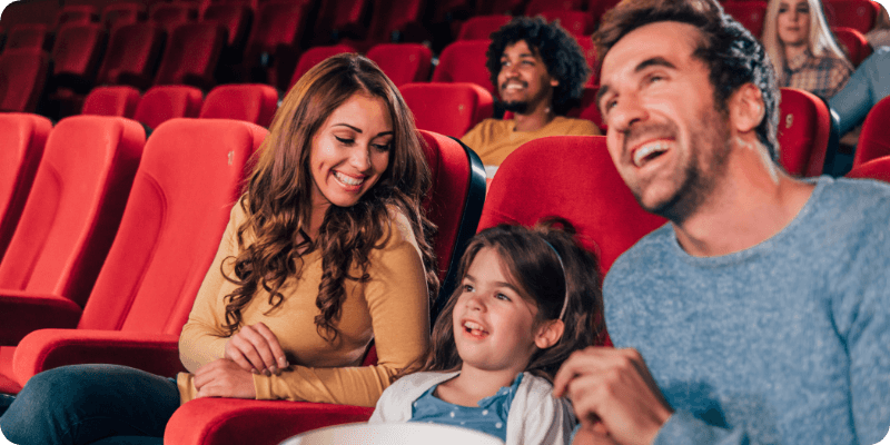 family enjoying time together at the cinema