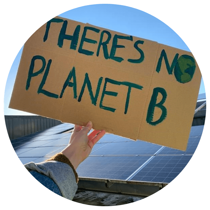 Activist holding a no planet B cardboard sign