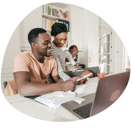 young family using a laptop together