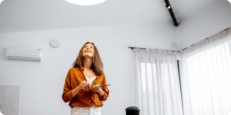 woman conducting a home energy assessment