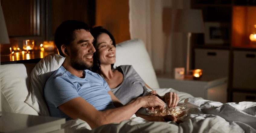 couple watching tv at night