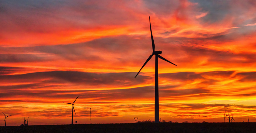 wind turbines in a sunset